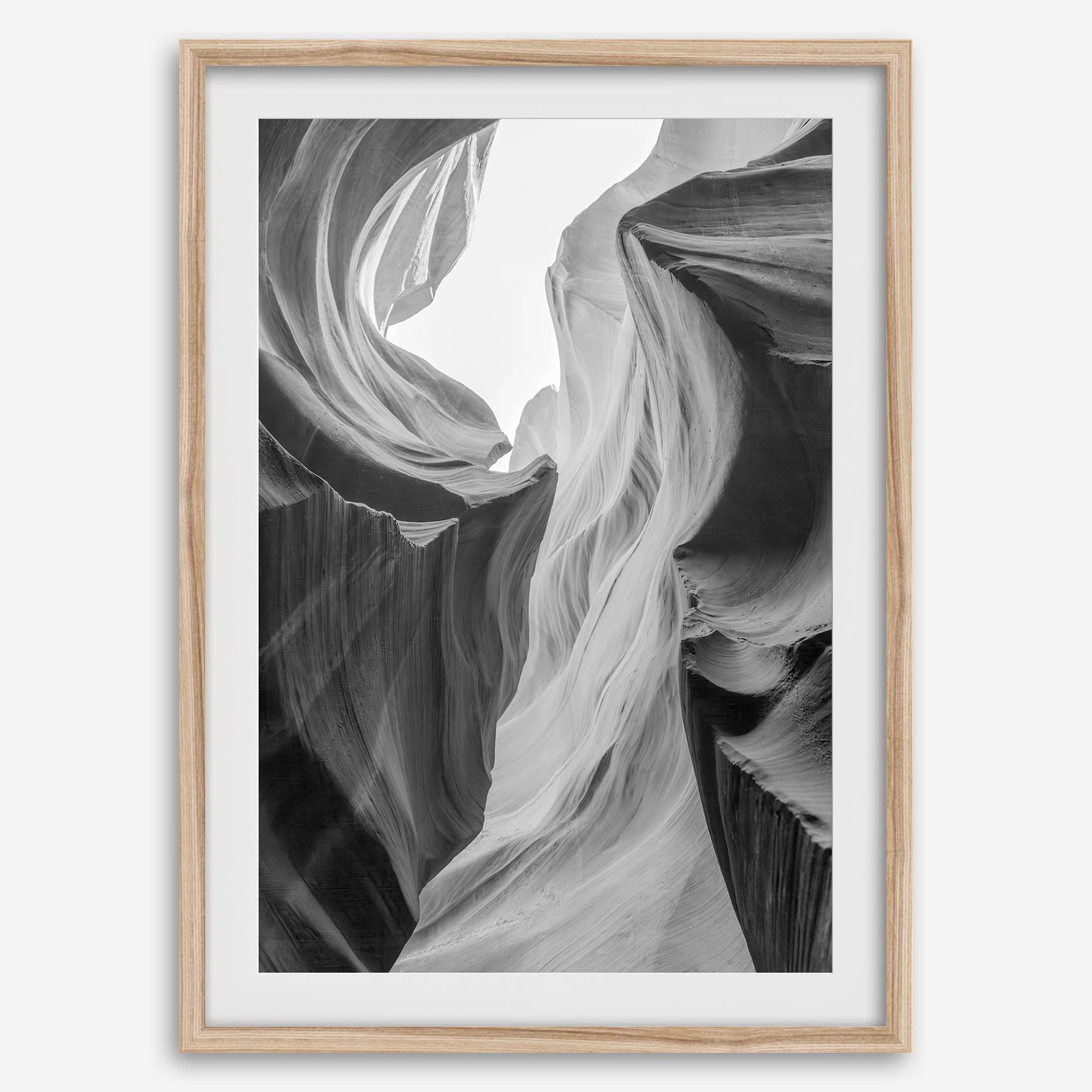 Black and white Antelope Canyon wall art showcasing deep shadows and intricate rock formations in Arizona’s iconic slot canyon.