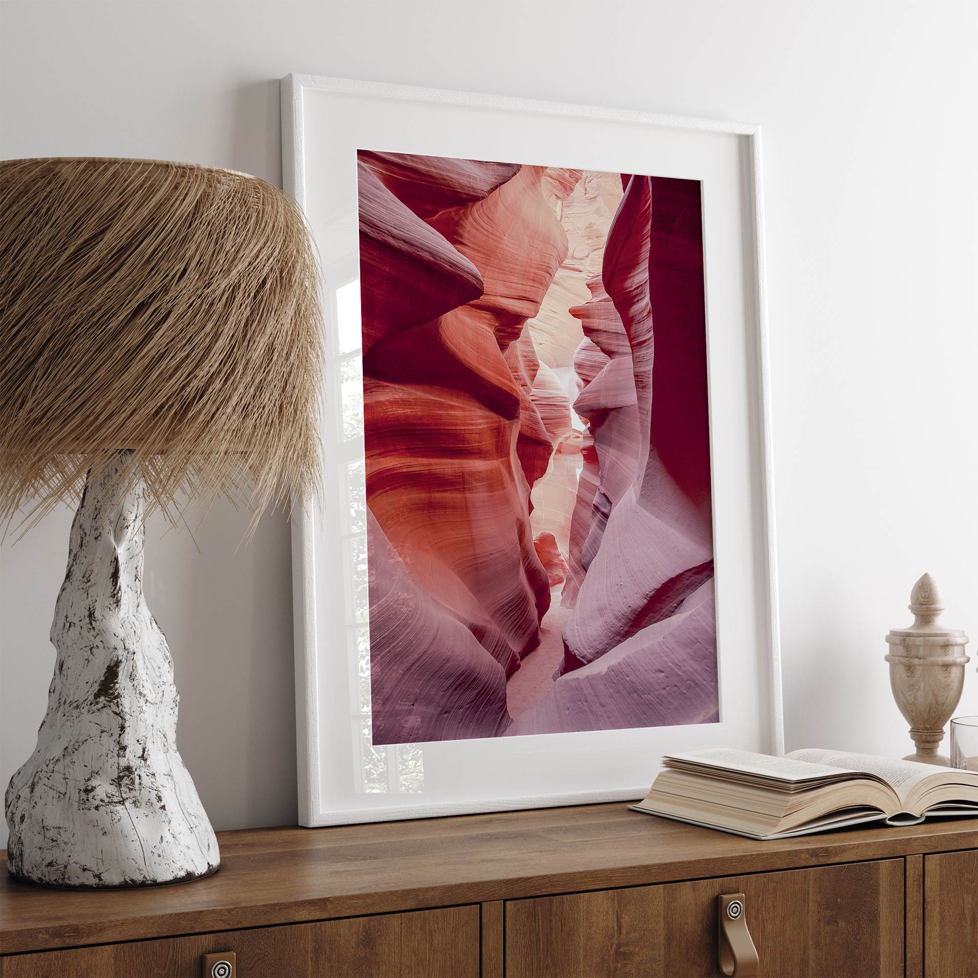 This beautiful Arizona desert wall art captures the mesmerizing beauty of Antelope Canyon. The picture showcases a passage through the rock in the canyon, with vibrant pink and purple textures that create a sense of depth and dimension.