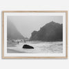 A framed black and white print of the beautiful Pfeiffer Beach in Big Sur hung in the living room. This wall art showcases the dramatic rocks and mist of the Big Sur coastline and the day-to-day life of the beach.