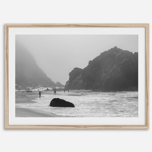 A framed black and white print of the beautiful Pfeiffer Beach in Big Sur hung in the living room. This wall art showcases the dramatic rocks and mist of the Big Sur coastline and the day-to-day life of the beach.