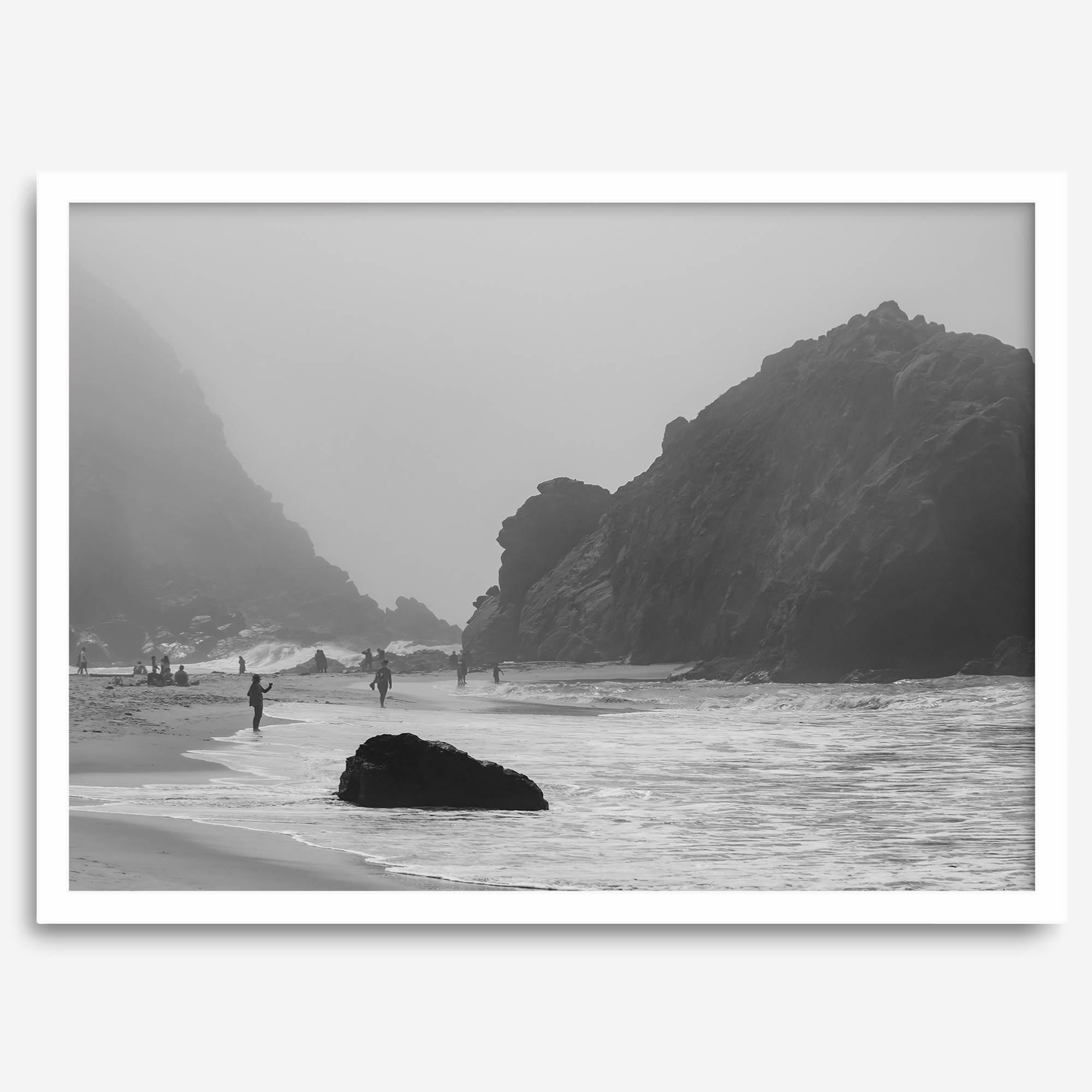 A framed black and white print of the beautiful Pfeiffer Beach in Big Sur hung in the living room. This wall art showcases the dramatic rocks and mist of the Big Sur coastline and the day-to-day life of the beach.