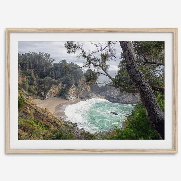 This fine art coastal ocean print features a breathtaking view of Mcway Falls in Big Sur, California, falling to the beach and into the ocean. This fine art photography print captures the beauty and wilderness of nature.
