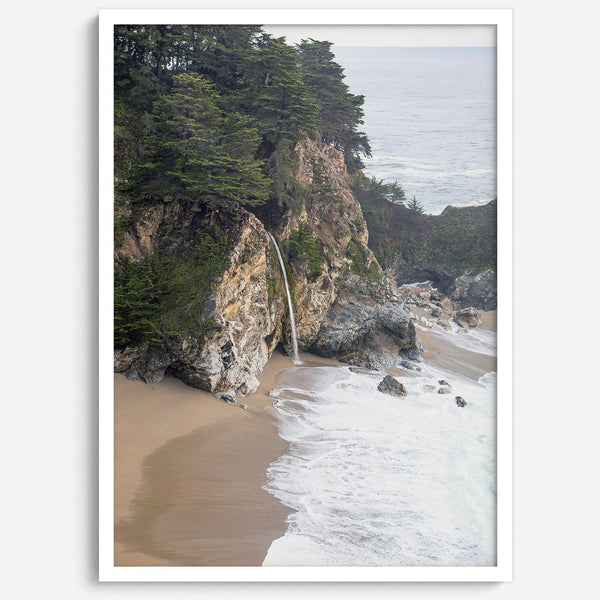 This captivating California coastal beach print captures the awe-inspiring scene of McWay Falls in Big Sur, as its creamy waterfall cascades onto a pristine beach and merges with the rhythmic dance of the ocean waves.