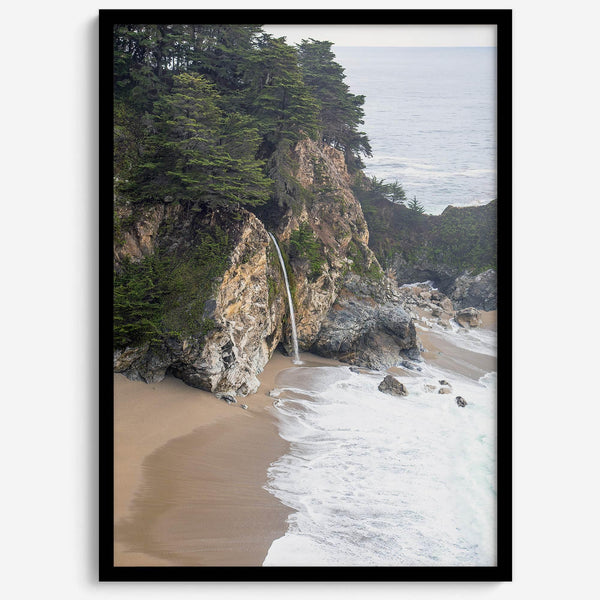 This captivating California coastal beach print captures the awe-inspiring scene of McWay Falls in Big Sur, as its creamy waterfall cascades onto a pristine beach and merges with the rhythmic dance of the ocean waves.