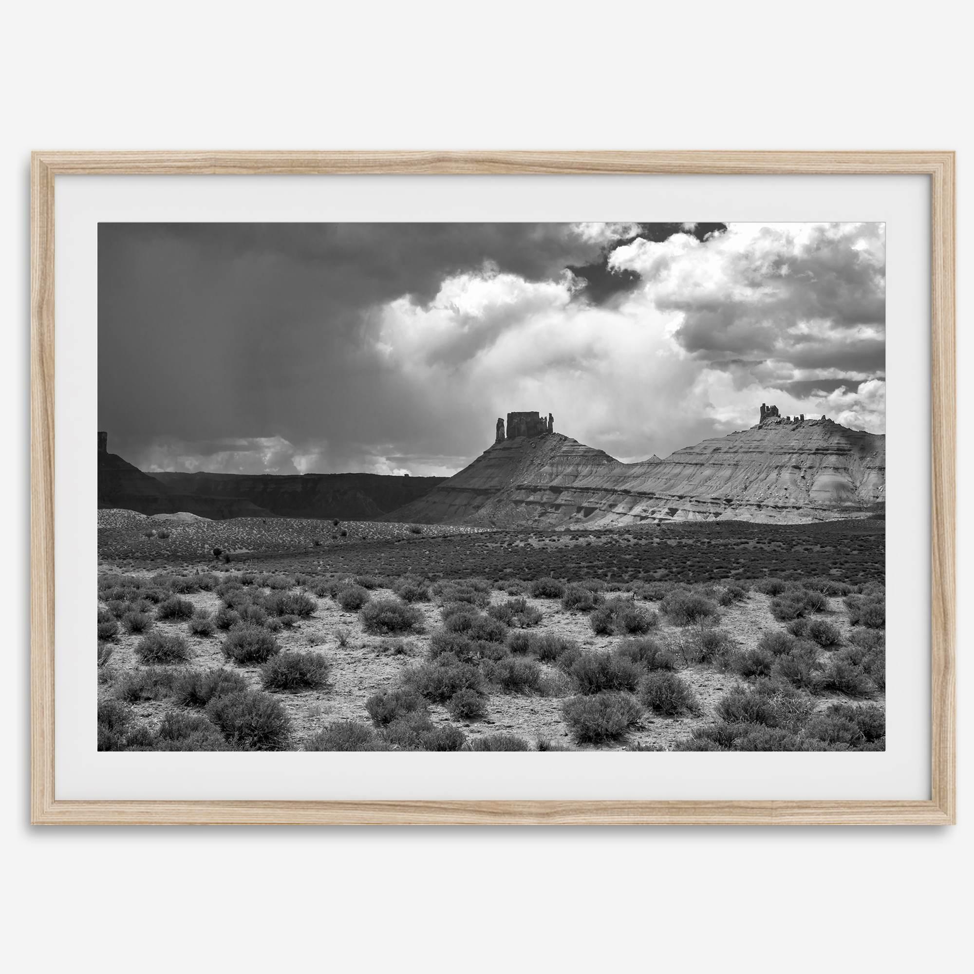 Black and white Utah wall art featuring dramatic desert rock formations and storm clouds