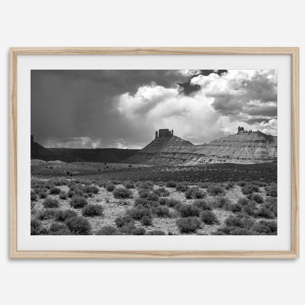 Black and white Utah wall art featuring dramatic desert rock formations and storm clouds