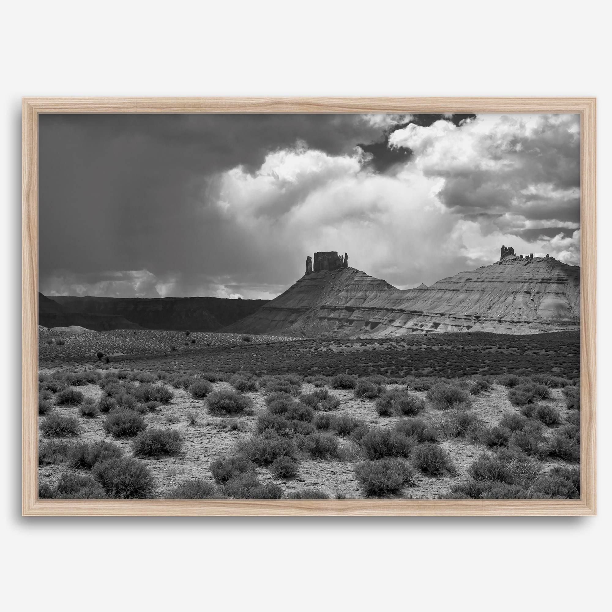 Black and white Utah wall art featuring dramatic desert rock formations and storm clouds