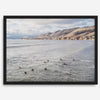 Surfers paddling near Pismo Beach captured in a fine art photography print with coastal cliffs and serene ocean views.