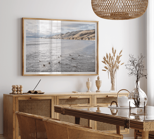 Black-and-WSurfers paddling near Pismo Beach captured in a fine art photography print with coastal cliffs and serene ocean views.hite-Ocean-Surf-Fne-Art-Print-