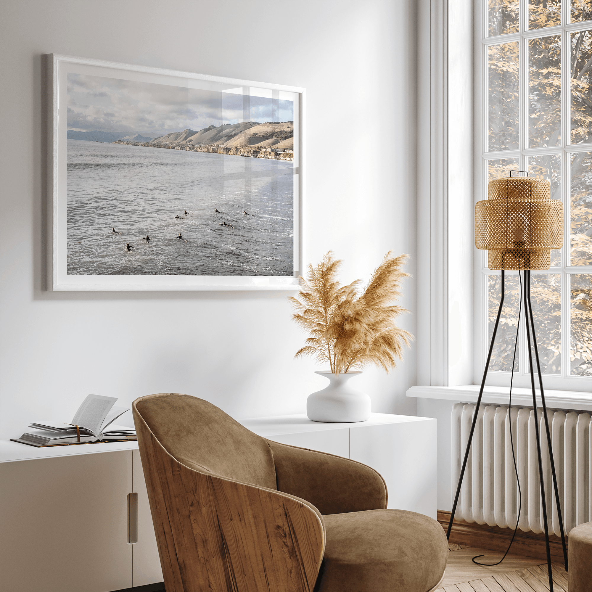 Surfers paddling near Pismo Beach captured in a fine art photography print with coastal cliffs and serene ocean views.