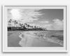 Black and white tropical wall art featuring a serene sunrise on a beach in Kauai, Hawaii with palm trees