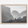 A black and white photography wall art of Yosemite Valley at sunset, featuring the iconic Half Dome and El Capitan bathed in dramatic light and shadow. Perfect for nature lovers and art enthusiasts.