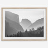 A black and white photography wall art of Yosemite Valley at sunset, featuring the iconic Half Dome and El Capitan bathed in dramatic light and shadow. Perfect for nature lovers and art enthusiasts.