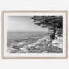 Black and white coastal art featuring Pebble Beach’s rocky shoreline and ocean view.