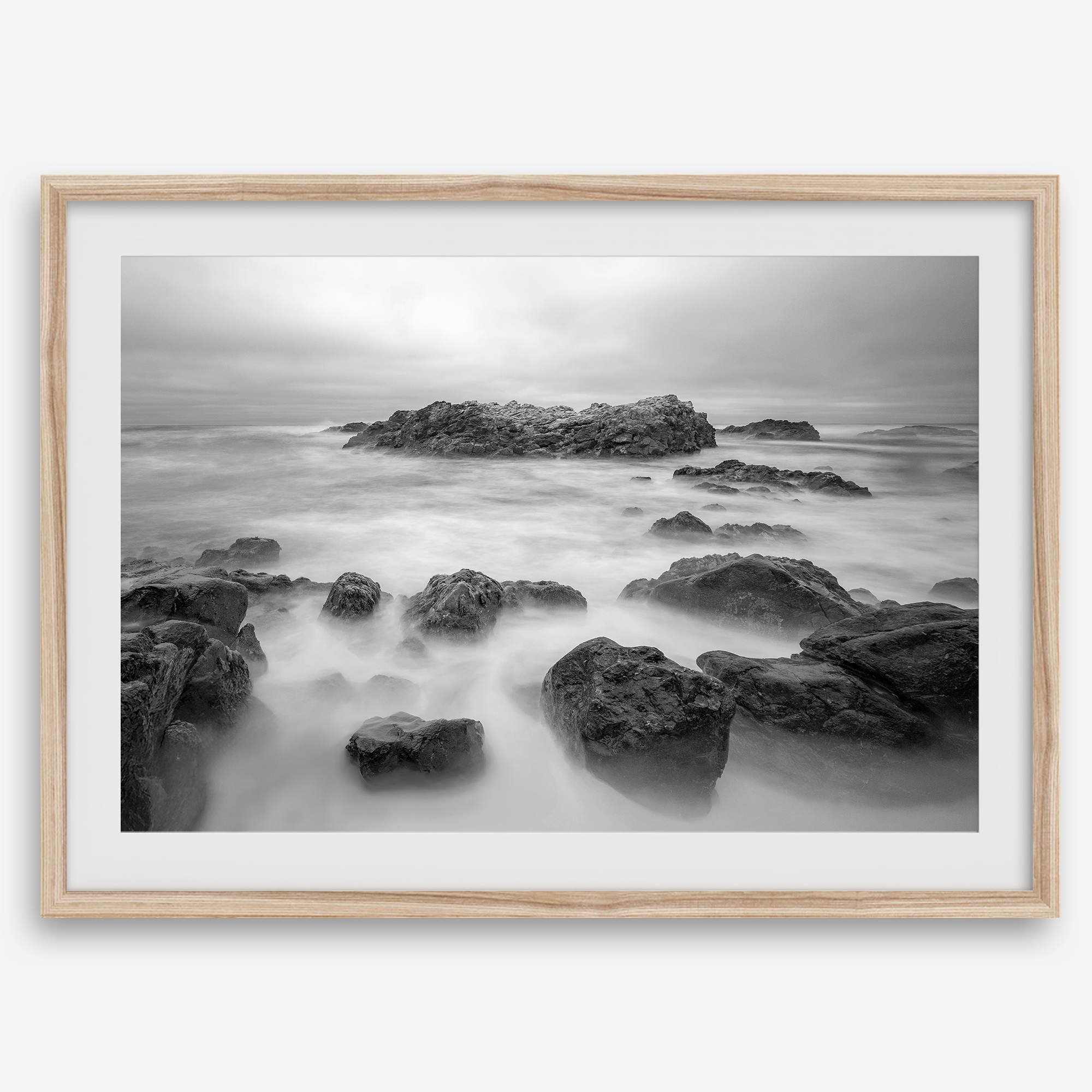 Stunning moody black and white beach fine art print from Pescadero, California. The Pacific Ocean looks creamy in this fine art long-exposure photography print.