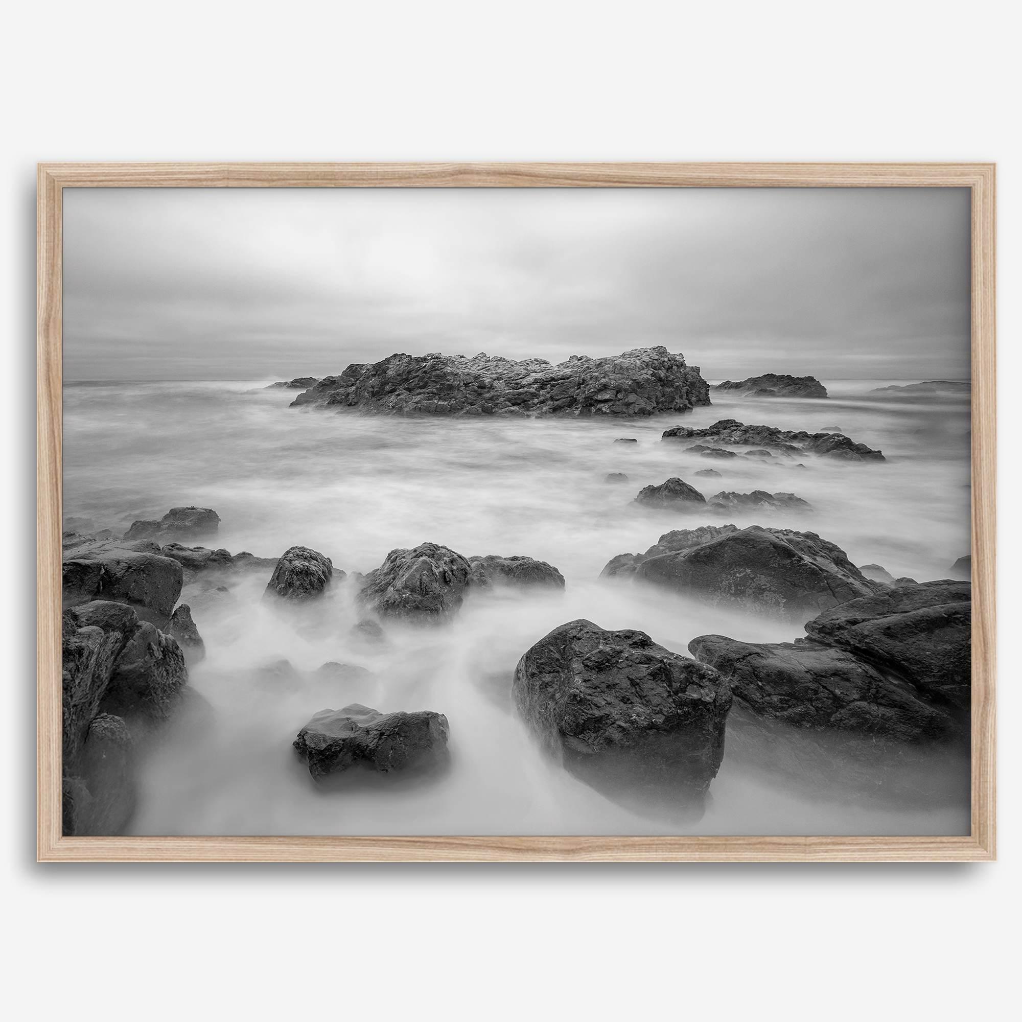 Stunning moody black and white beach fine art print from Pescadero, California. The Pacific Ocean looks creamy in this fine art long-exposure photography print.