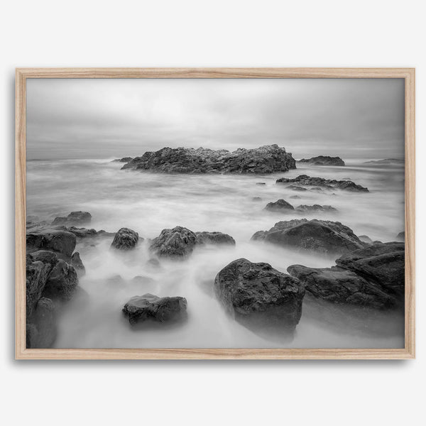 Stunning moody black and white beach fine art print from Pescadero, California. The Pacific Ocean looks creamy in this fine art long-exposure photography print.