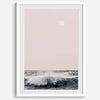 This extraordinary ocean wall art captures a mesmerizing moment when a powerful wave crashes while the sunset gentle blush pink hues fill the sky and a large full moon rises majestically in the backdrop.
