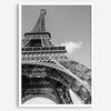 A fine art Eiffel Tower black and white print. This Paris theme wall art showcases a unique wide-angle view from the bottom of the tower, creating a modern, trendy fine art photography to hang on your walls.