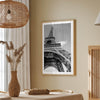 A fine art Eiffel Tower black and white print. This Paris theme wall art showcases a unique wide-angle view from the bottom of the tower, creating a modern, trendy fine art photography to hang on your walls.
