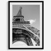 A fine art Eiffel Tower black and white print. This Paris theme wall art showcases a unique wide-angle view from the bottom of the tower, creating a modern, trendy fine art photography to hang on your walls.