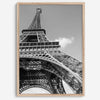 A fine art Eiffel Tower black and white print. This Paris theme wall art showcases a unique wide-angle view from the bottom of the tower, creating a modern, trendy fine art photography to hang on your walls.