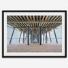 A fine art boho style beach photography print featuring a view from below Pismo Beach Pier.