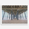A fine art boho style beach photography print featuring a view from below Pismo Beach Pier.