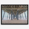 A fine art boho style beach photography print featuring a view from below Pismo Beach Pier.