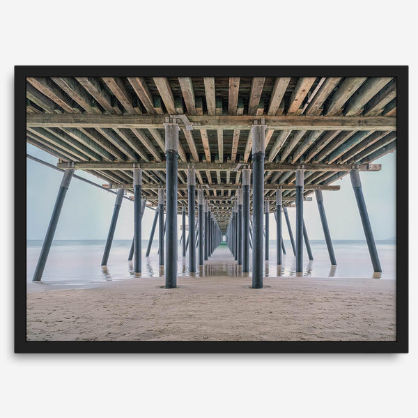 A fine art boho style beach photography print featuring a view from below Pismo Beach Pier.