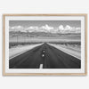 This stunning piece of black and white desert wall art will take your breath away. A beautifully framed picture of a Death Valley National Park road leading towards the snow-covered mountains at the end of the desert.