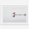 A fine art minimalist wildlife photography print showcasing a bird flying over a lake in Arizona.