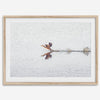 A fine art minimalist wildlife photography print showcasing a bird flying over a lake in Arizona.