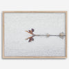 A fine art minimalist wildlife photography print showcasing a bird flying over a lake in Arizona.