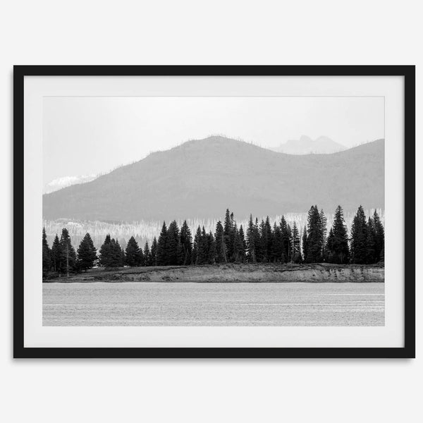 Abstract nature art of a forested island on Yellowstone Lake with black-and-white photography and misty mountains.