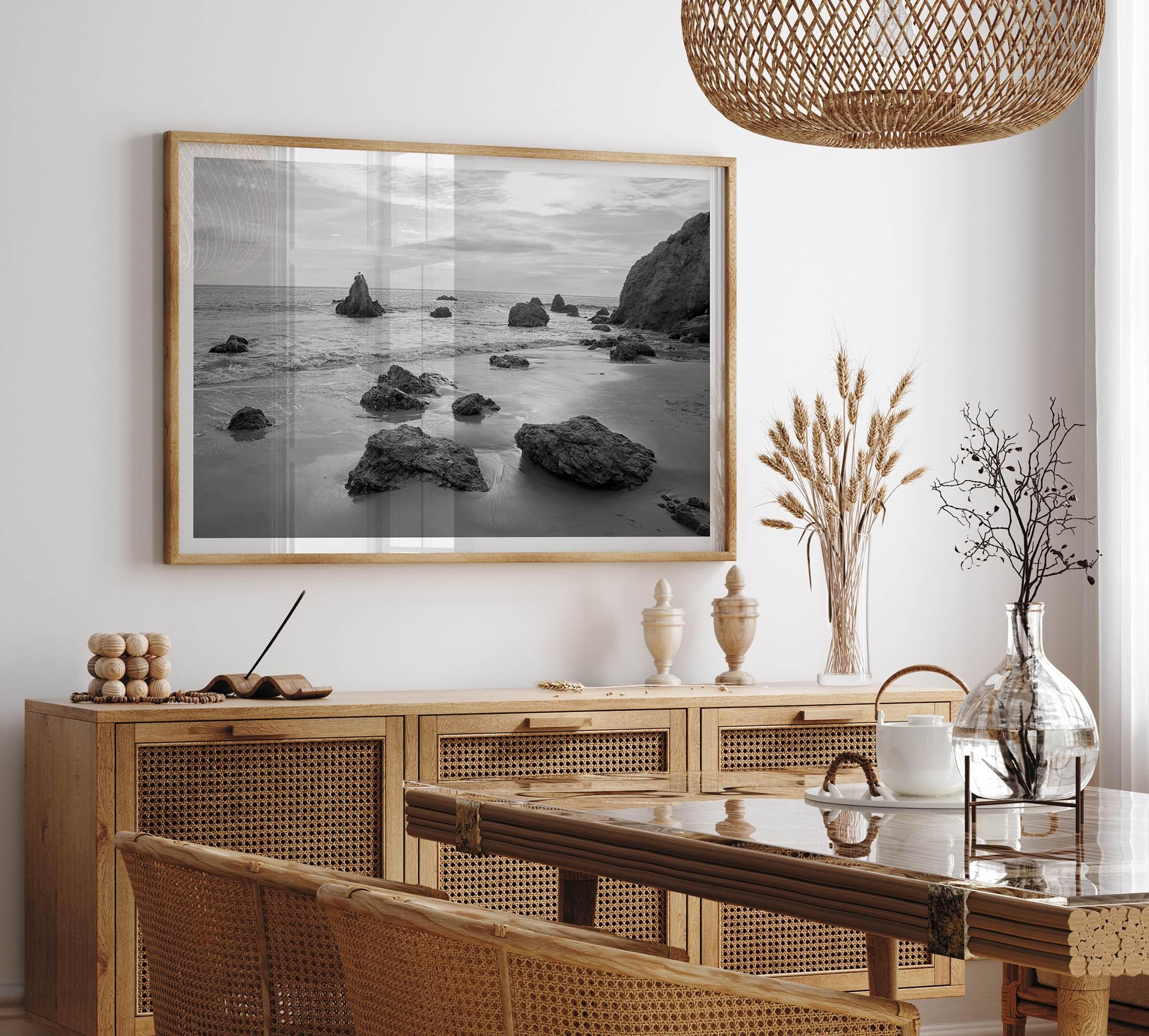 A fine art black and white beach print featuring El Matador State Beach in MalIbu. This southwest coastal decor captures the ragged beauty of the California coast.