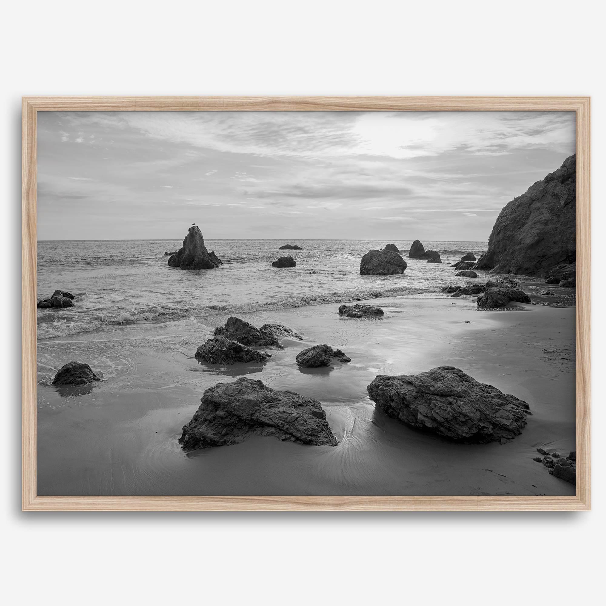 A fine art black and white beach print featuring El Matador State Beach in MalIbu. This southwest coastal decor captures the ragged beauty of the California coast.