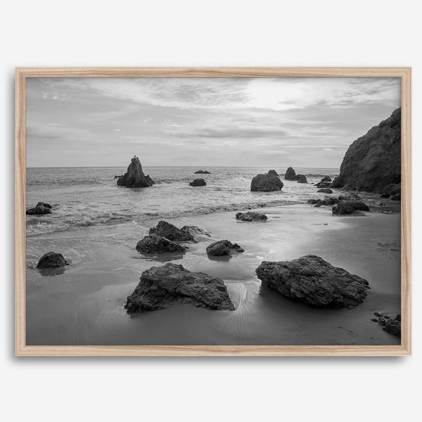 A fine art black and white beach print featuring El Matador State Beach in MalIbu. This southwest coastal decor captures the ragged beauty of the California coast.