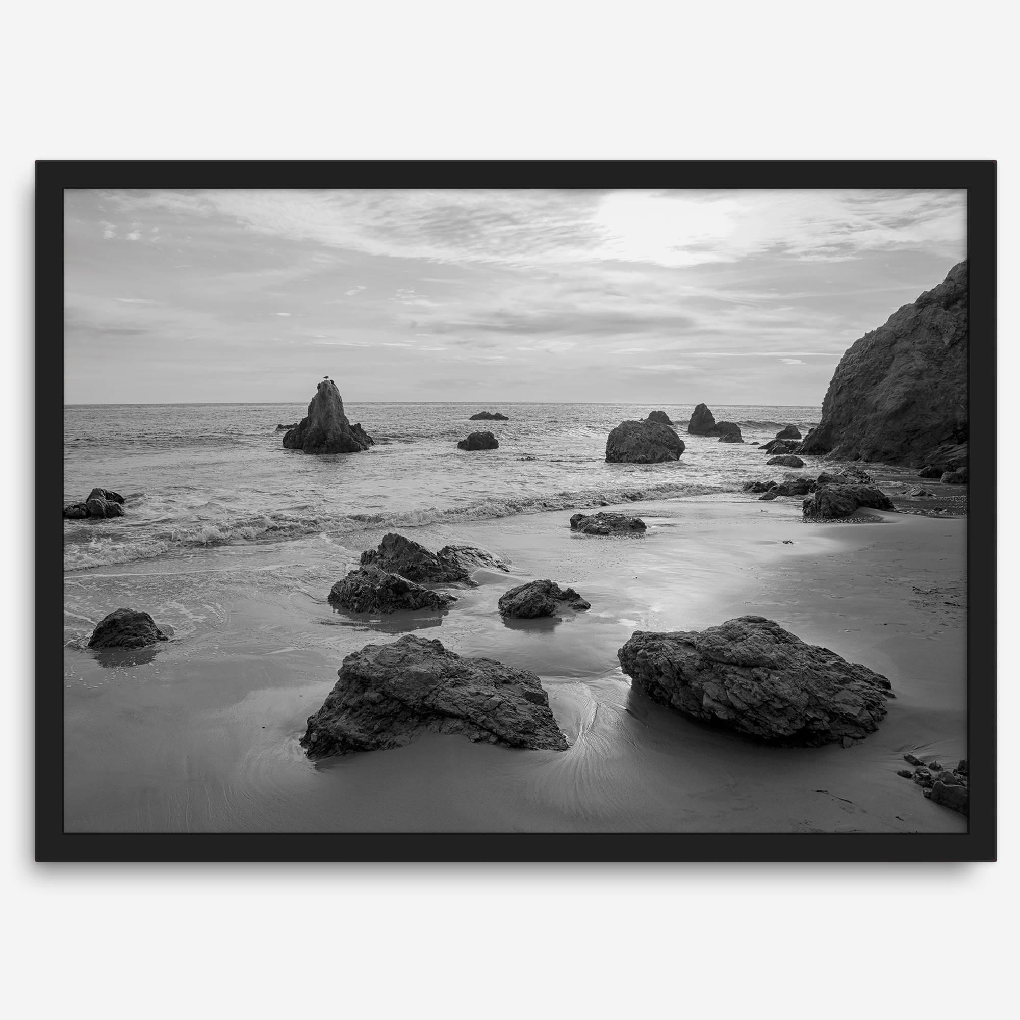 A fine art black and white beach print featuring El Matador State Beach in MalIbu. This southwest coastal decor captures the ragged beauty of the California coast.