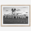 Black and white photo of the Pismo Beach street sign with palm trees and boardwalk – fine art coastal print