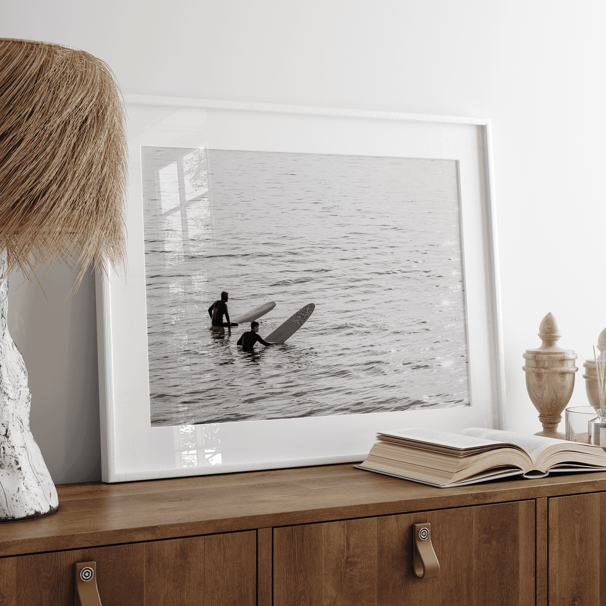 Black and white photo of two surfers with longboards waiting in calm ocean water – fine art surf photography print