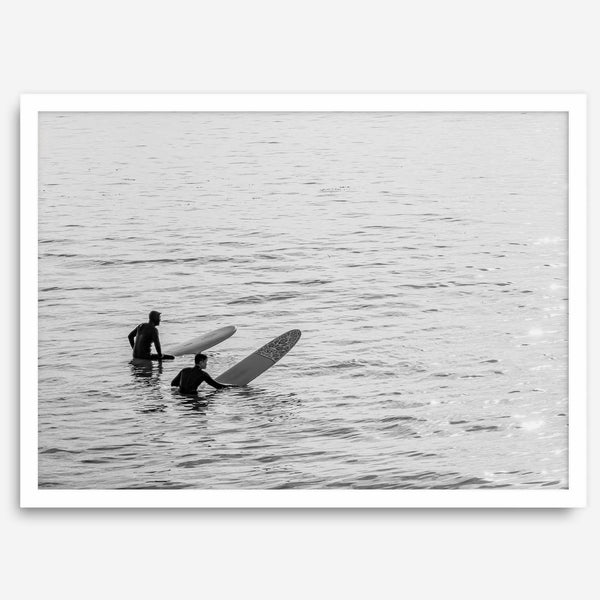 Black and white photo of two surfers with longboards waiting in calm ocean water – fine art surf photography print