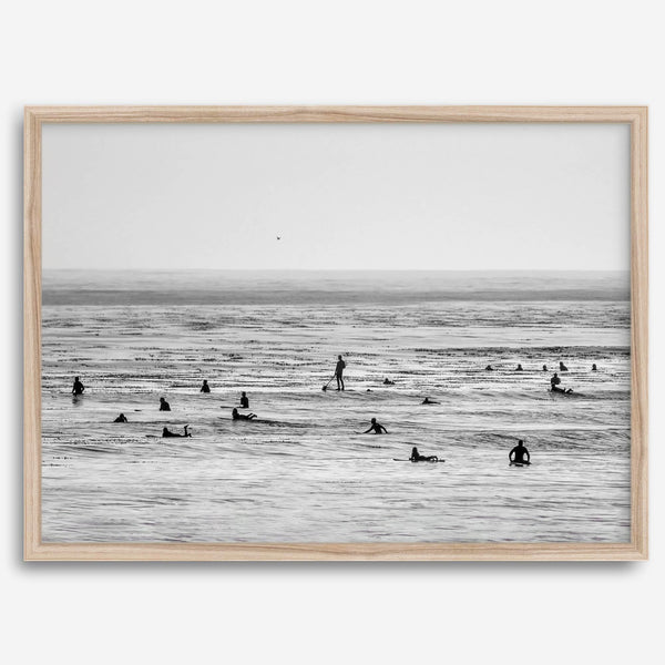Black and white surf prints showing surfers in calm ocean waters, perfect for beach house wall art or minimalist coastal decor.