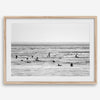 Black and white surf prints showing surfers in calm ocean waters, perfect for beach house wall art or minimalist coastal decor.