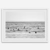 Black and white surf prints showing surfers in calm ocean waters, perfect for beach house wall art or minimalist coastal decor.