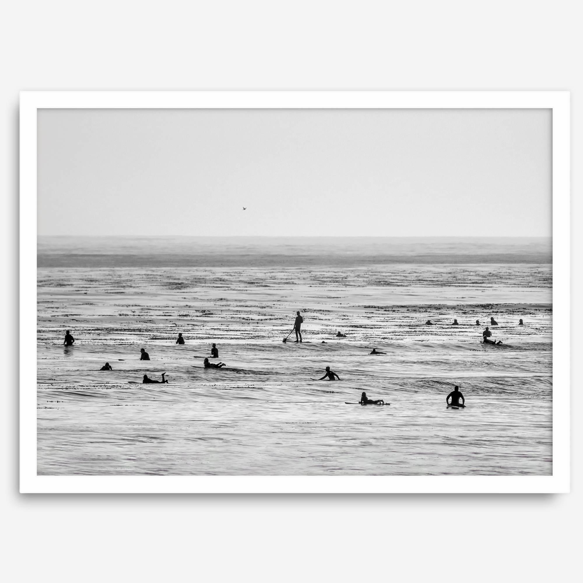 Black and white surf prints showing surfers in calm ocean waters, perfect for beach house wall art or minimalist coastal decor.