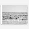 Black and white surf prints showing surfers in calm ocean waters, perfect for beach house wall art or minimalist coastal decor.
