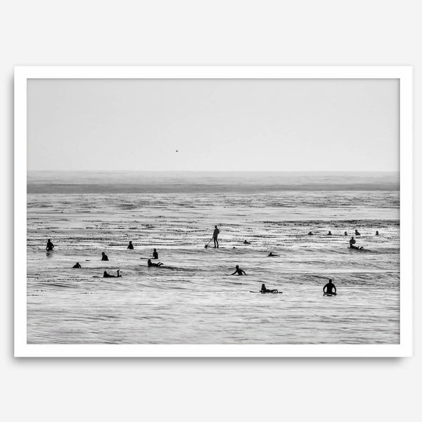 Black and white surf prints showing surfers in calm ocean waters, perfect for beach house wall art or minimalist coastal decor.