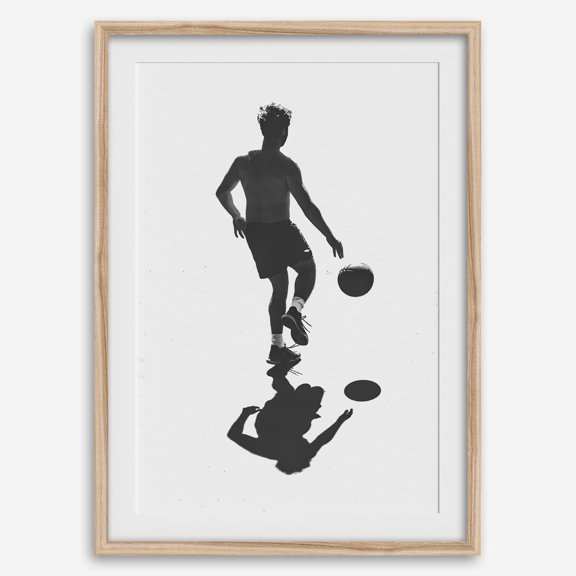 Black and white basketball wall art featuring a silhouetted player and reflective composition in minimalist fine art photography.
