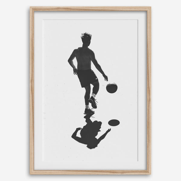 Black and white basketball wall art featuring a silhouetted player and reflective composition in minimalist fine art photography.
